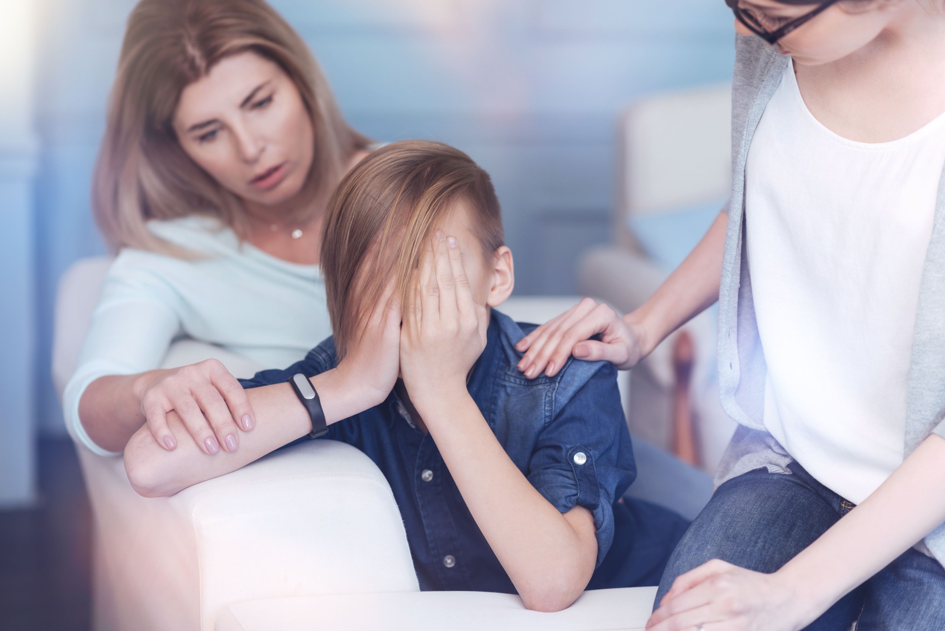 Problem youngster crying while attending psychologist with his mother